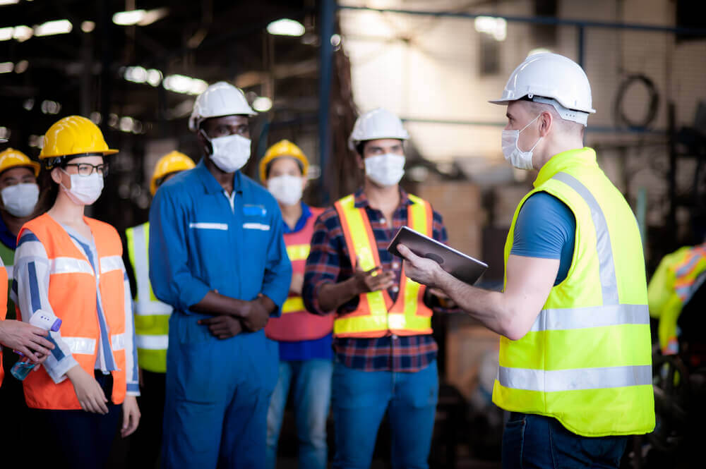 Group of people training in factory
